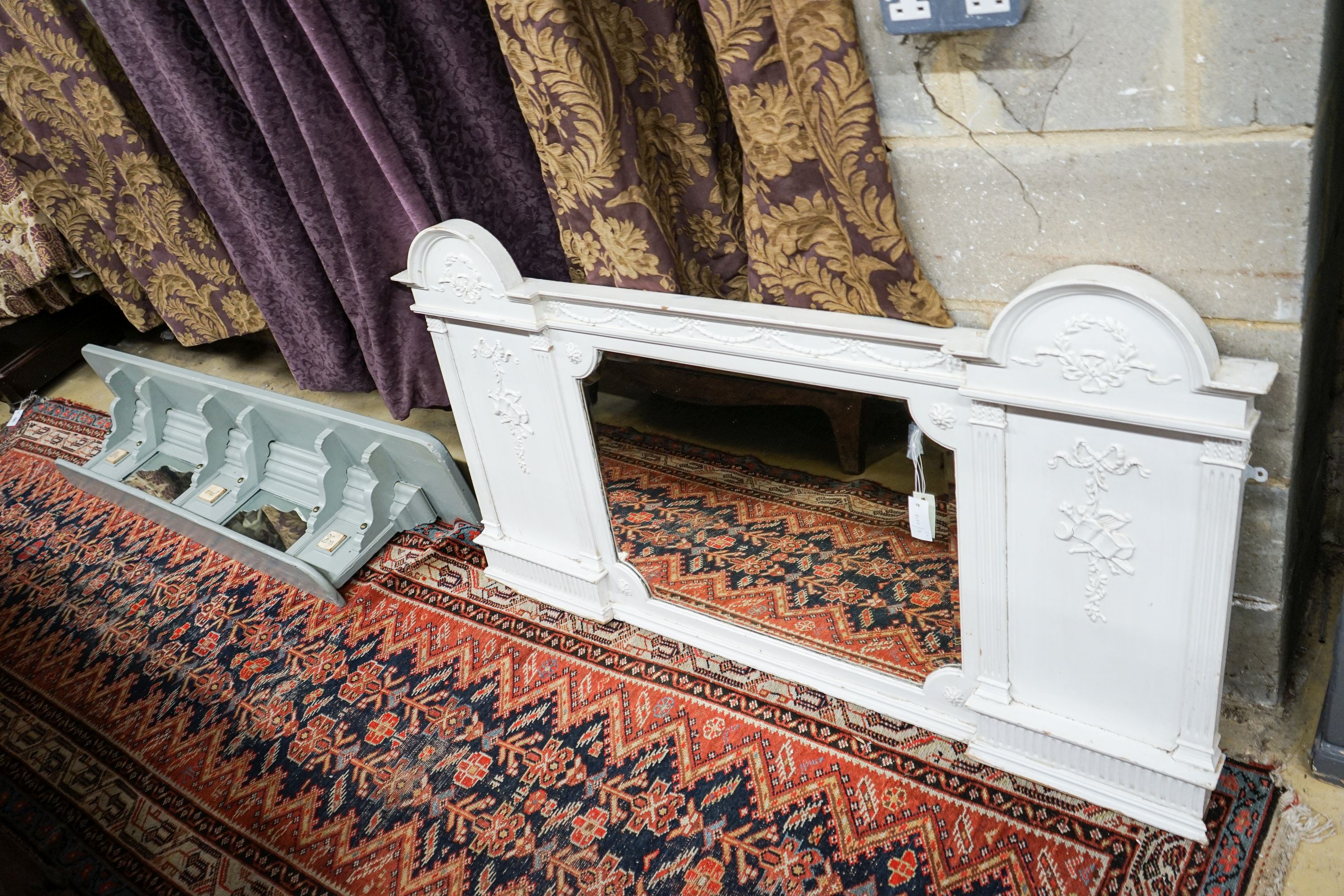 A Victorian later painted overmantel mirror, width 143cm, height 76cm together with a painted and mirrored overmantel